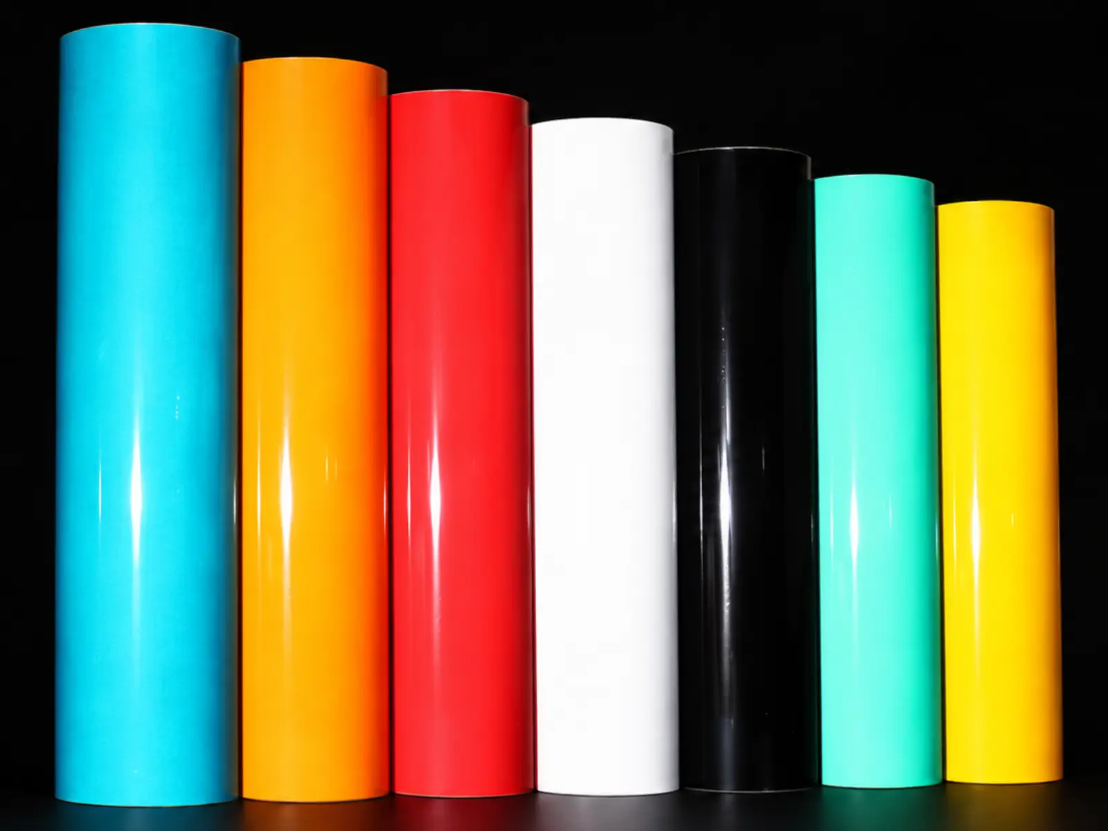 Rollos de lámina de superficie lisa en celeste, naranja, rojo, blanco, negro, verde y amarillo